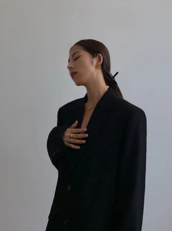 women wearing black color long blazer